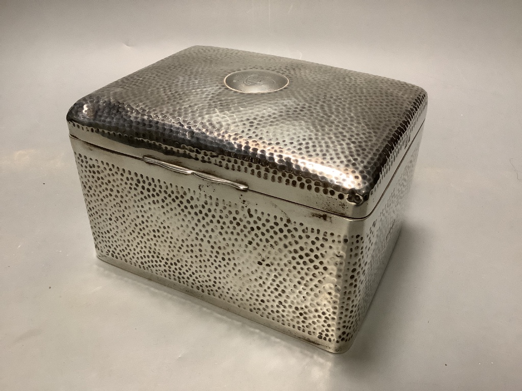 A late Victorian hammered silver cigarette box, London 1898, which 16 cm, gross weight, 32.5 ounces.